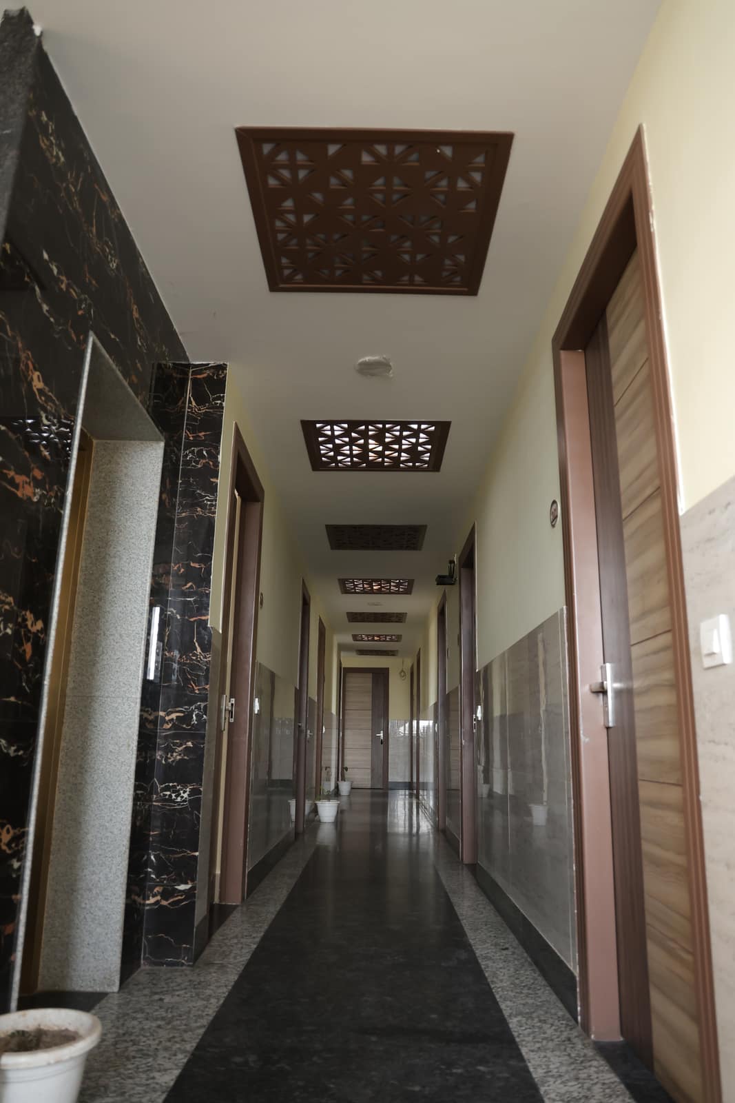 Clean, well-lit guest corridor at Hotel Oriental